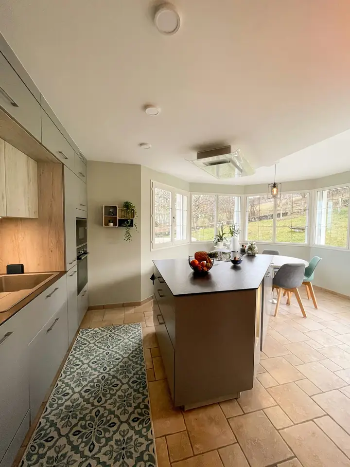 Kitchen with a bay window full of sunlight