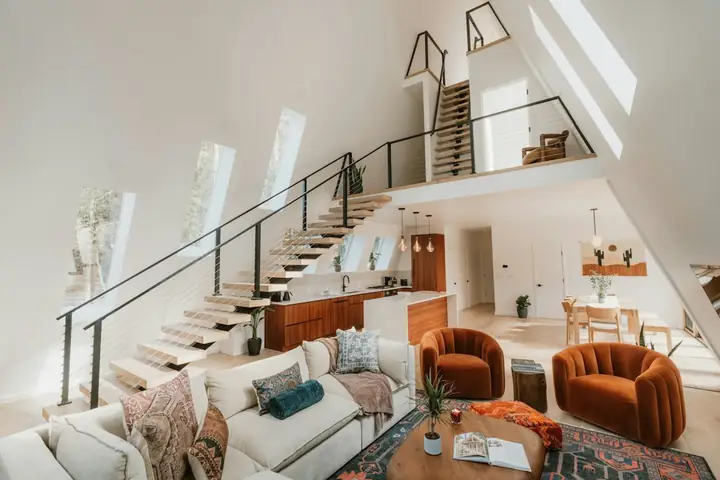 Open-plan loft living space with roof windows