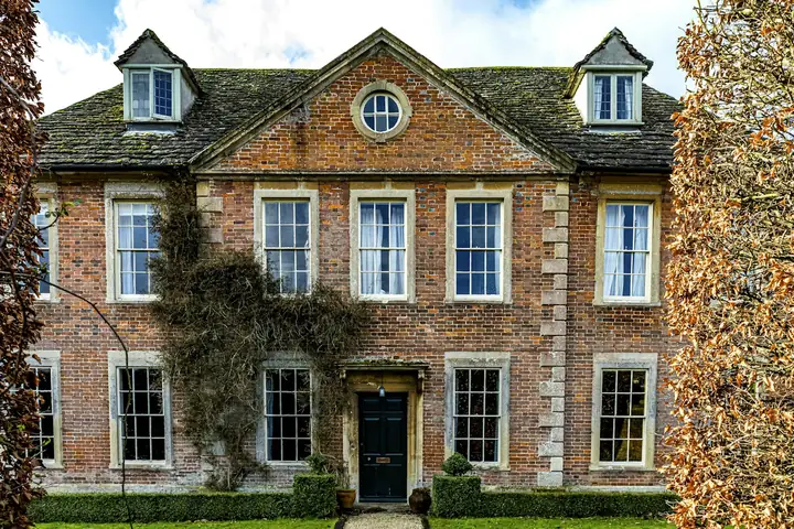 Period brick house with dormer windows